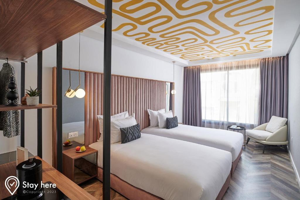 Postel nebo postele na pokoji v ubytování Stayhere Rabat - Agdal 4 - Hotel