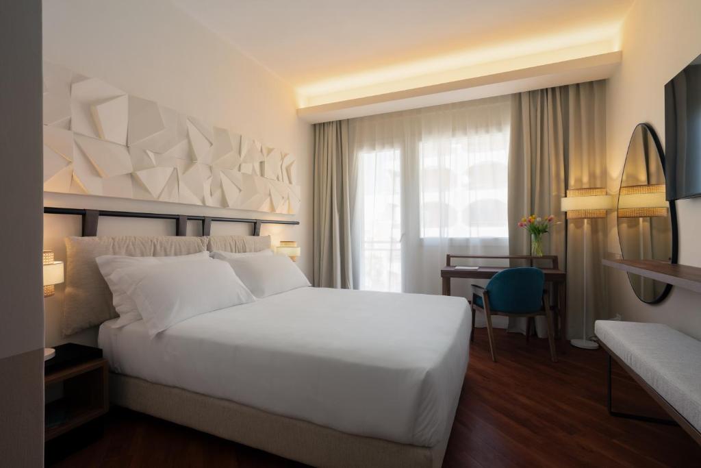 Postel nebo postele na pokoji v ubytování Hotel Delfino Taranto
