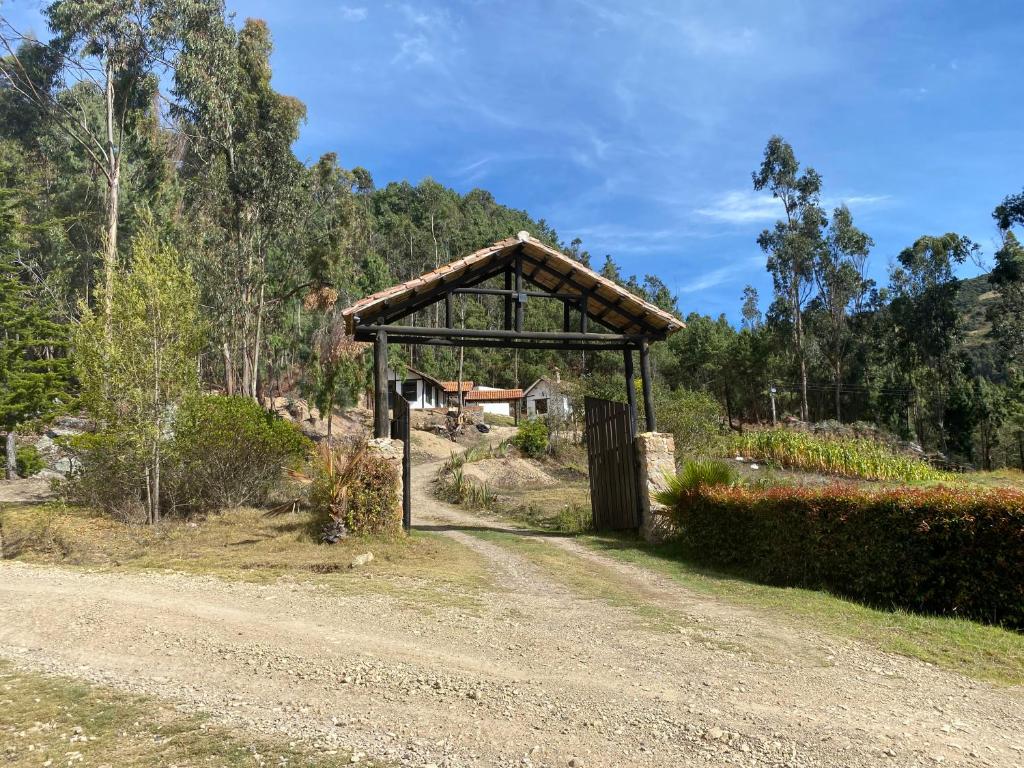 a pavilion on the side of a dirt road at REFUGIO LA CASONA in Cucaita