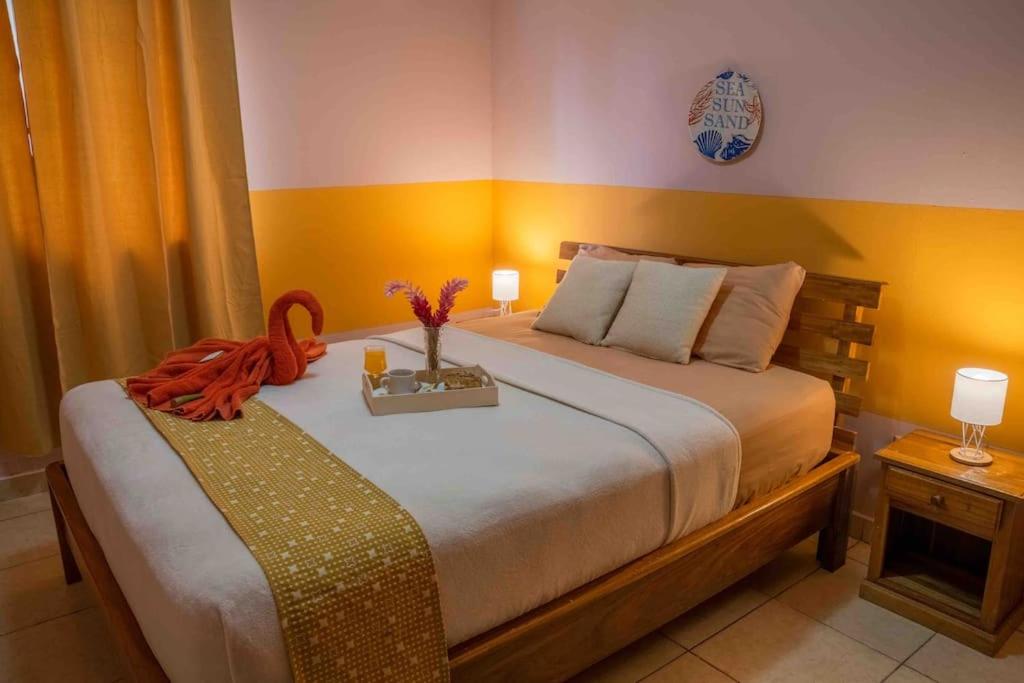 Postel nebo postele na pokoji v ubytování Caribbean Villages Aparments