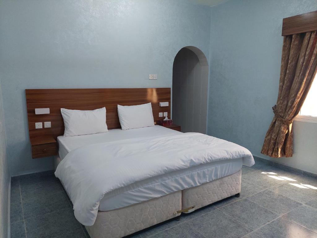 Postel nebo postele na pokoji v ubytování Hotel Ain Safnan Room&Flats فندق عين صفنان غرف&شقق
