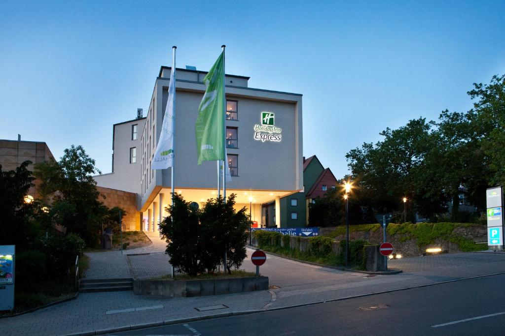 a building with a green flag on the side of it at Holiday Inn Express Fürth, an IHG Hotel in Fürth