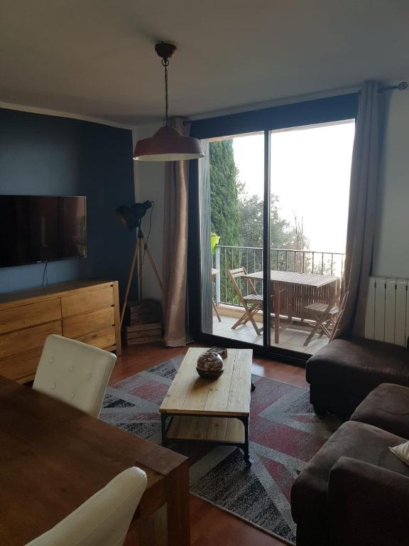 Posezení v ubytování Appartement chaleureux vue panoramique