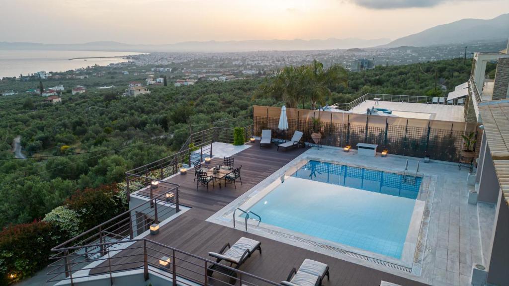 a pool on the roof of a house with a view at Senso Panorama Villa and Suite in Kalamata