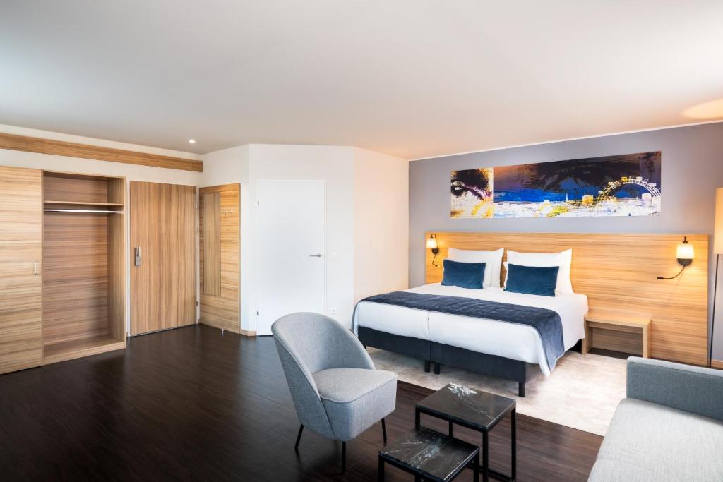Cama o camas de una habitación en Leonardo Hotel Vienna Schönbrunn