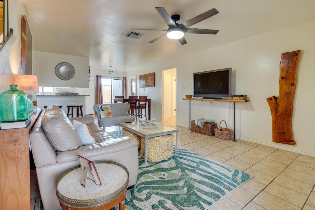 a living room with a couch and a ceiling fan at San Antonio Townhome 3 Mi to Lackland AFB! in San Antonio