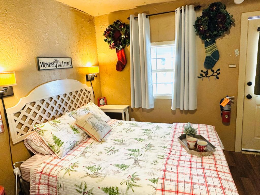 a bedroom with a bed and a window at Acorn Hideaways Canton Delightful Christmas Suite Year Round in Canton