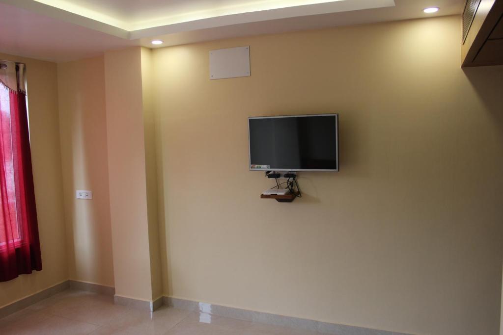 TV a/nebo společenská místnost v ubytování White Coral