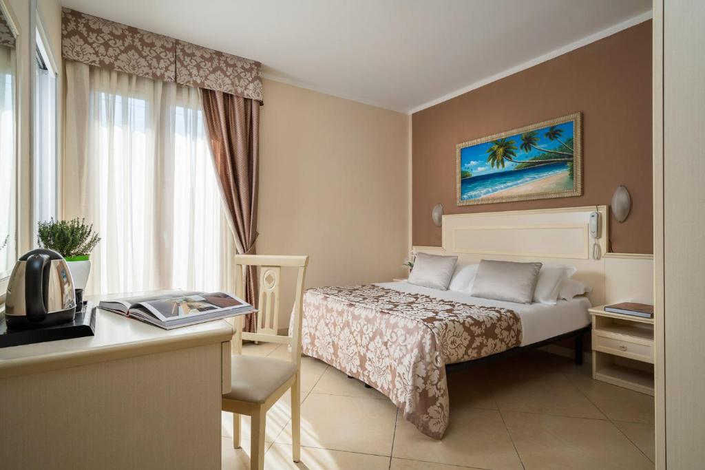 Postel nebo postele na pokoji v ubytování Albergo Ristorante Pozzi