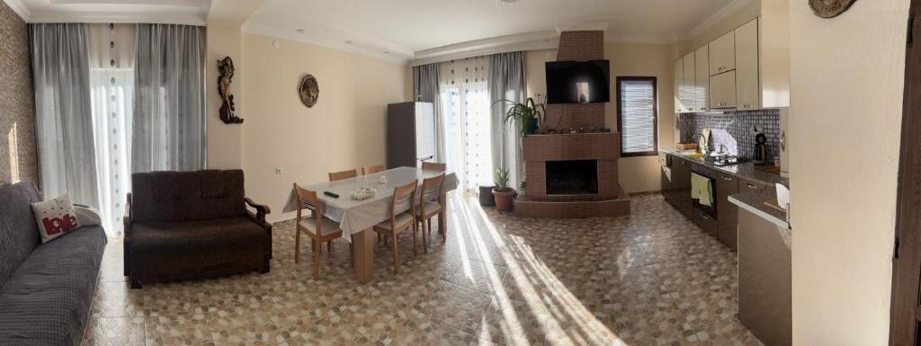 a living room with a couch and a dining room at Villa in Bakuriani in Bakuriani