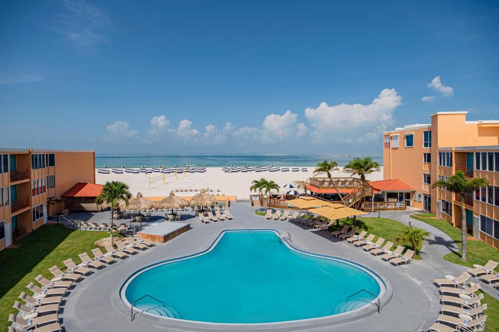 an aerial view of a resort with a swimming pool and the beach at Dolphin Beach Resort in St Pete Beach