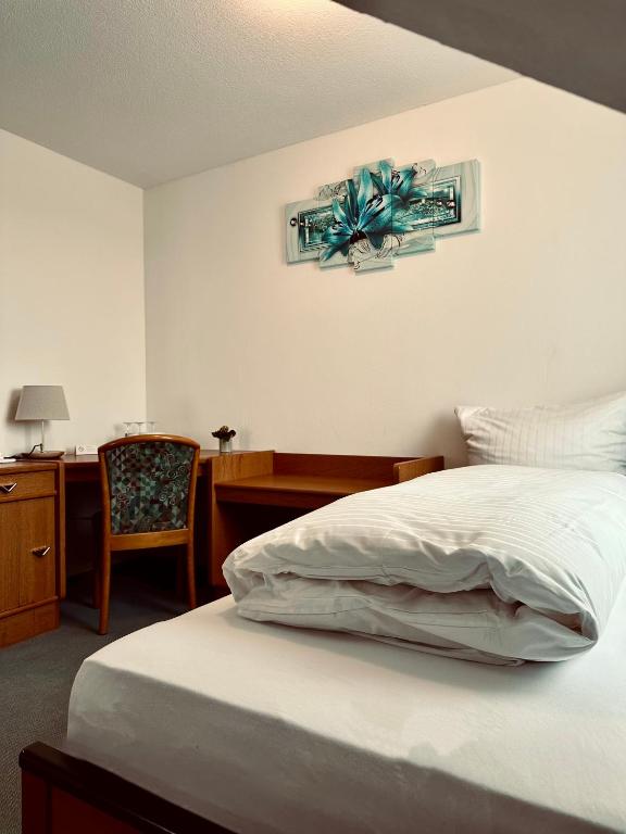 Postel nebo postele na pokoji v ubytování E&D Hotel Rodgau
