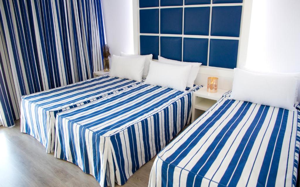Posteľ alebo postele v izbe v ubytovaní ALEGRIA Sun Village