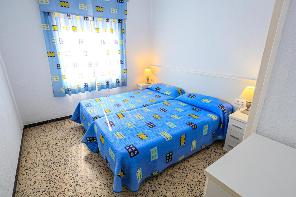 Postel nebo postele na pokoji v ubytování Xaloc ONLY FAMILIES
