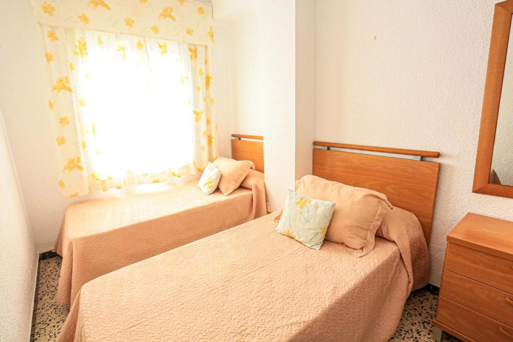 Postel nebo postele na pokoji v ubytování Xaloc ONLY FAMILIES
