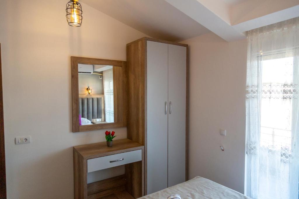 Postel nebo postele na pokoji v ubytování Kenzy Apartments