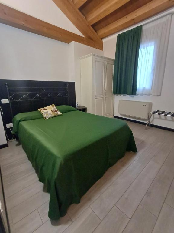 Postel nebo postele na pokoji v ubytování Arneroni