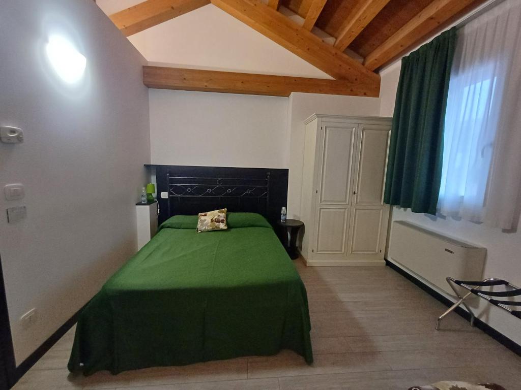 Postel nebo postele na pokoji v ubytování Arneroni