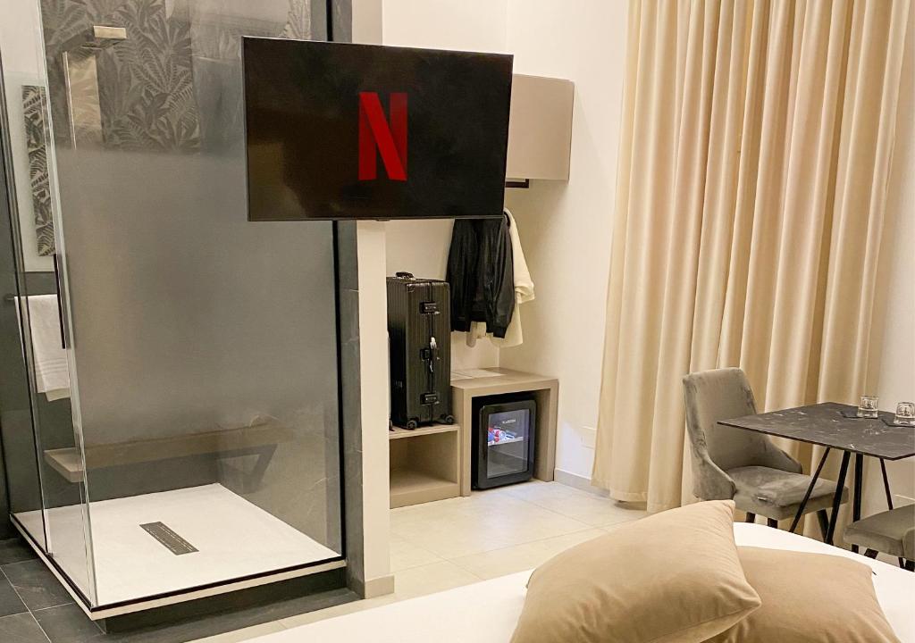 TV a/nebo společenská místnost v ubytování Olympus Capua