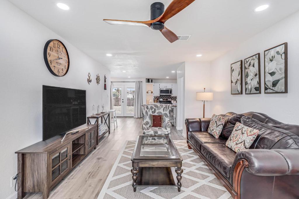 a living room with a couch and a tv at Corpus Christi Charm in Corpus Christi