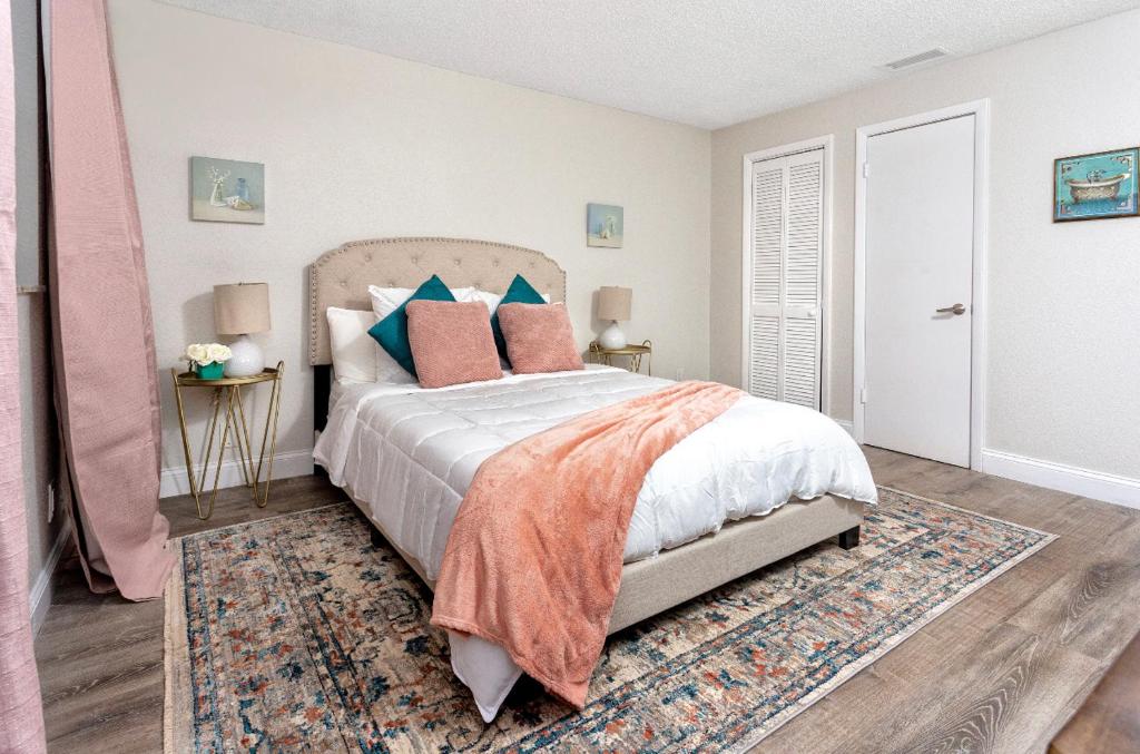 a bedroom with a large bed and a rug at 1034 3rd Ave SW Unit B in Largo