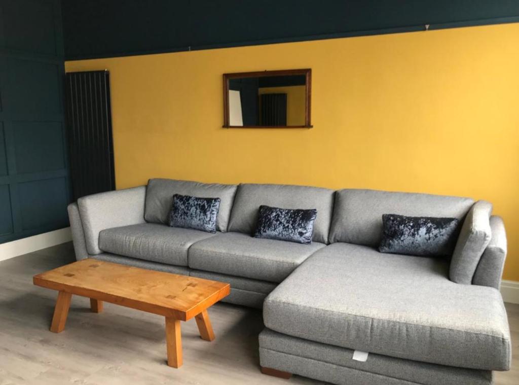 a living room with a couch and a coffee table at Ninian Park Road in Cardiff