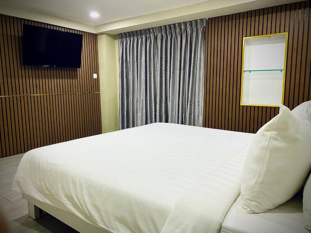 Postel nebo postele na pokoji v ubytování DE Hotel