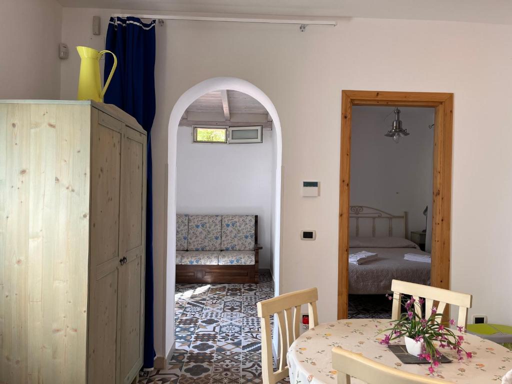 Łóżko lub łóżka w pokoju w obiekcie Casette Masseria La Camardia
