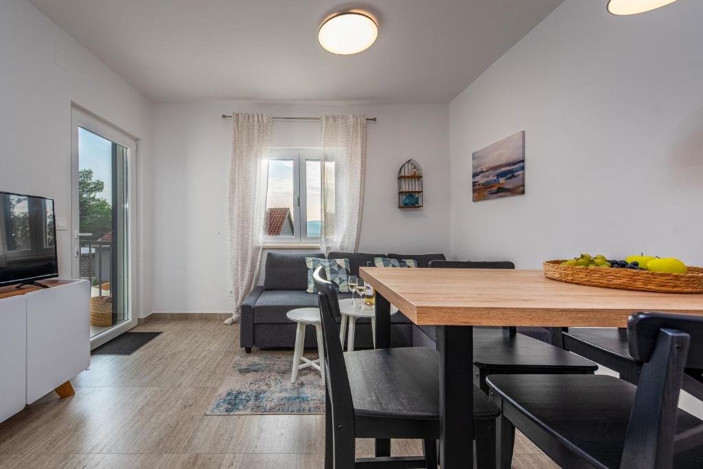 Televízia a/alebo spoločenská miestnosť v ubytovaní Dalmor holiday house