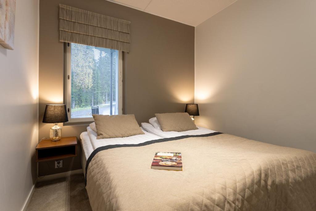 Кровать или кровати в номере Vuokatti Booking Suites