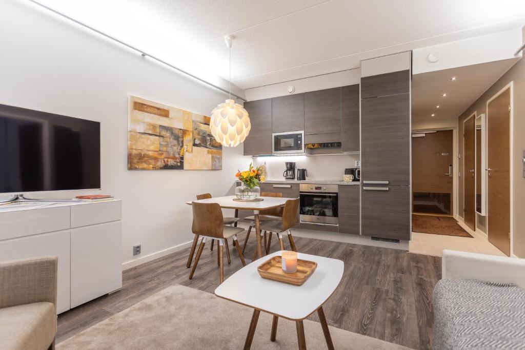 Кухня или мини-кухня в Vuokatti Booking Suites
