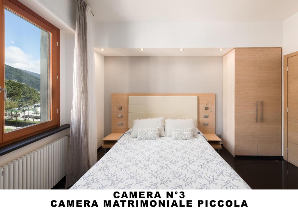 Postel nebo postele na pokoji v ubytování Affittacamere Lo Scoglio (Guesthouse)