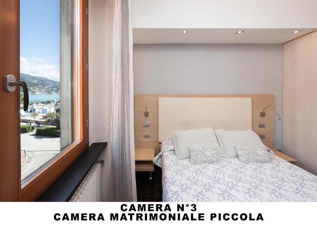 Postel nebo postele na pokoji v ubytování Affittacamere Lo Scoglio (Guesthouse)