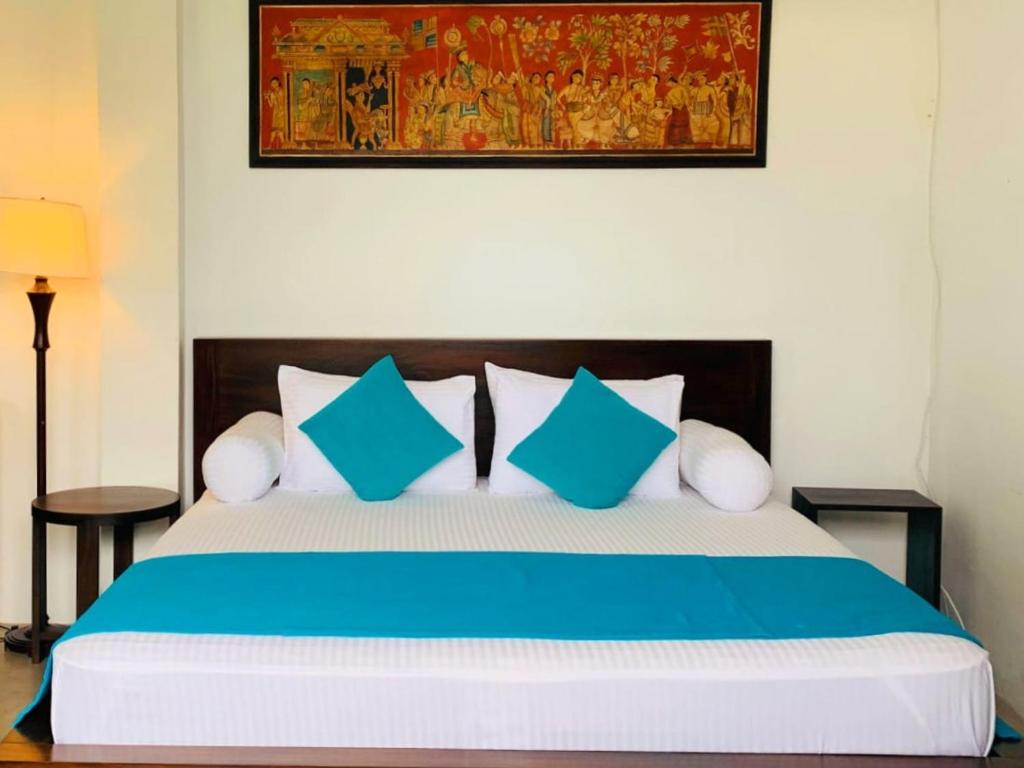 Postel nebo postele na pokoji v ubytování Angam Villas Colombo