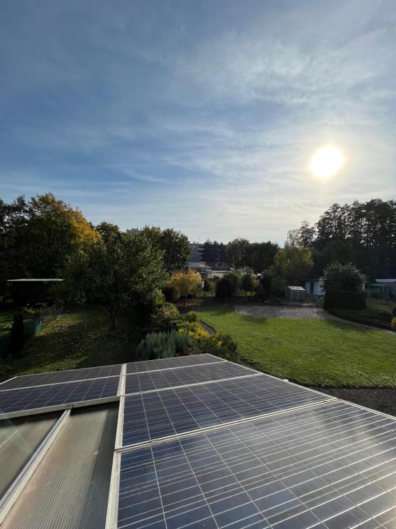 a group of solar panels on top of a roof at Ubytování Pardubice Trnová in Pardubice