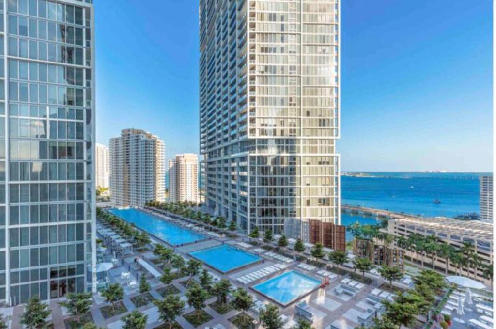 an aerial view of a city with tall buildings at Amazing 2 Bedroom at Icon in the Heart of Brickell in Miami