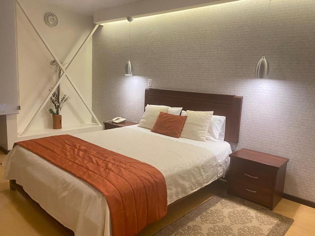 Postel nebo postele na pokoji v ubytování Suites Metropoli