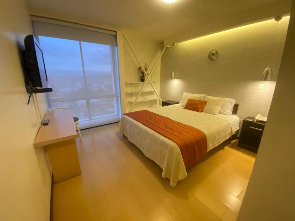 Postel nebo postele na pokoji v ubytování Suites Metropoli
