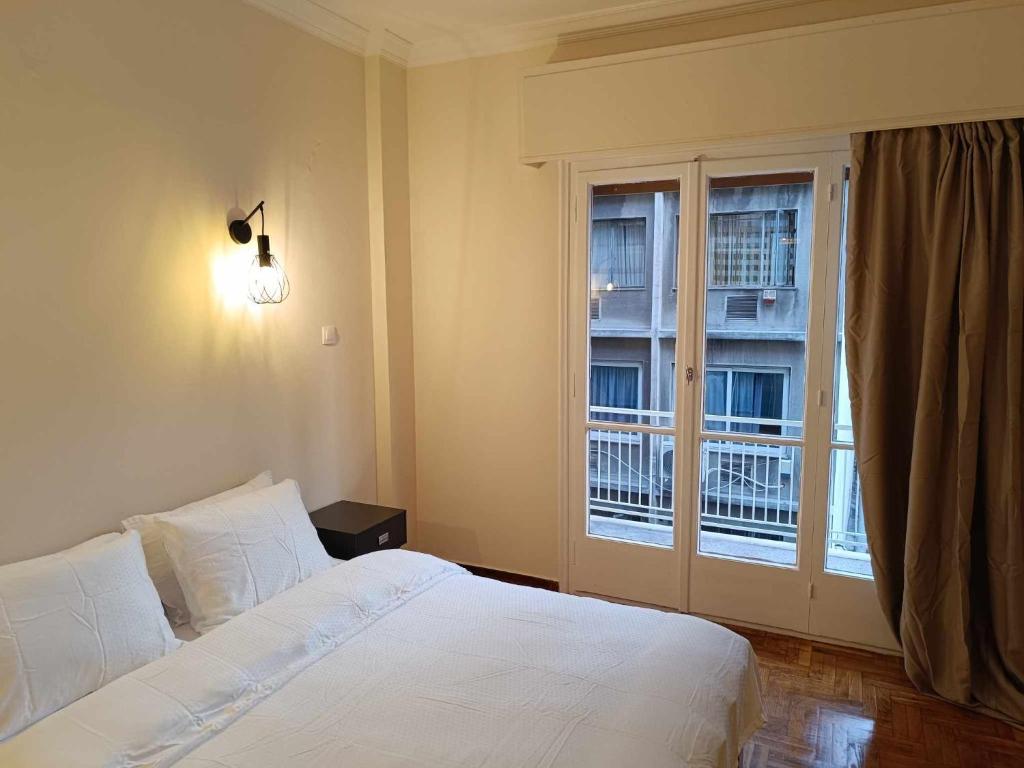 Katil atau katil-katil dalam bilik di Simply Athens Apartment