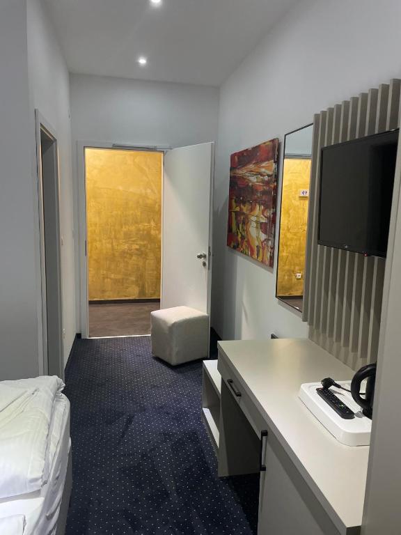 TV a/nebo společenská místnost v ubytování Gastpark Hotel