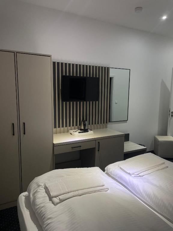 Postel nebo postele na pokoji v ubytování Gastpark Hotel