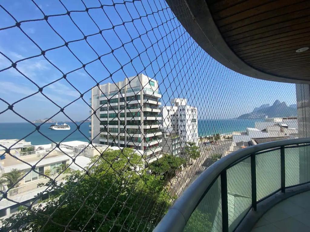a view of a building from a balcony at 30 secs to the beach, 3 balconies, 2 bdrms ensuite in Rio de Janeiro