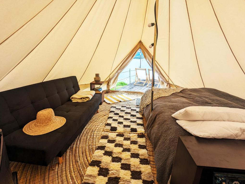 Postel nebo postele na pokoji v ubytování Glamping Yerbabuena