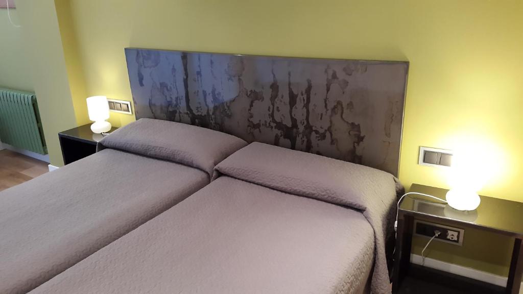 Postel nebo postele na pokoji v ubytování Alizaque Lodge