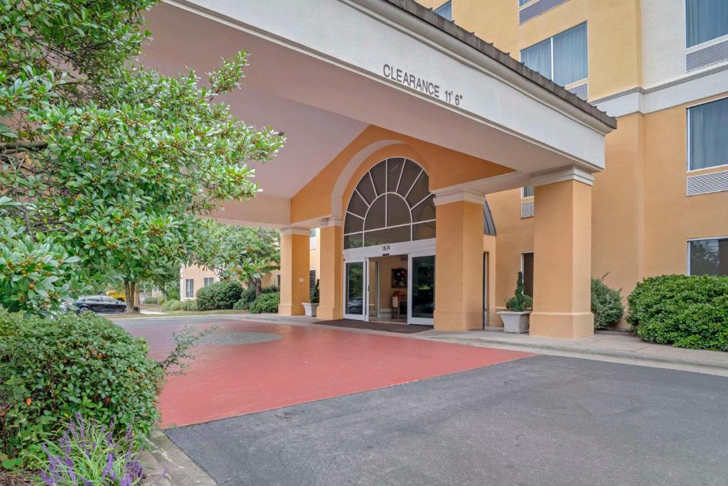 a building with a red carpet in front of a building at Comfort Suites Gastonia - Charlotte in Gastonia
