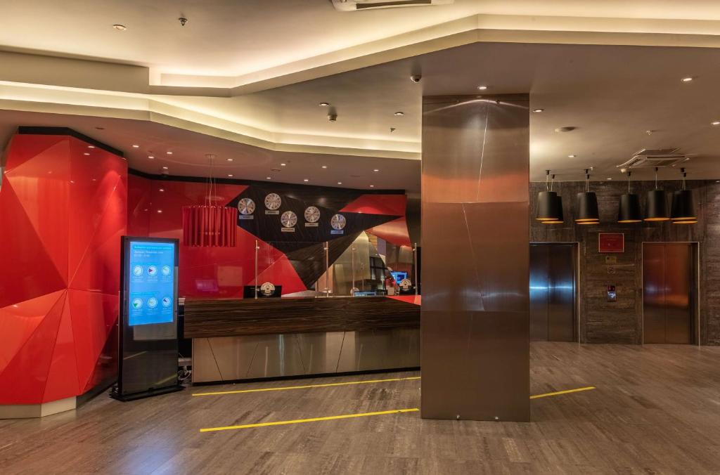a hotel lobby with a bar and a counter at Park Inn by Radisson Novosibirsk in Novosibirsk