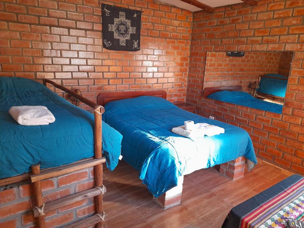 Postel nebo postele na pokoji v ubytování Casa Hospedaje"Los Capulies"
