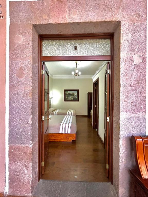 Postel nebo postele na pokoji v ubytování Hotel Cantera Real, Morelia