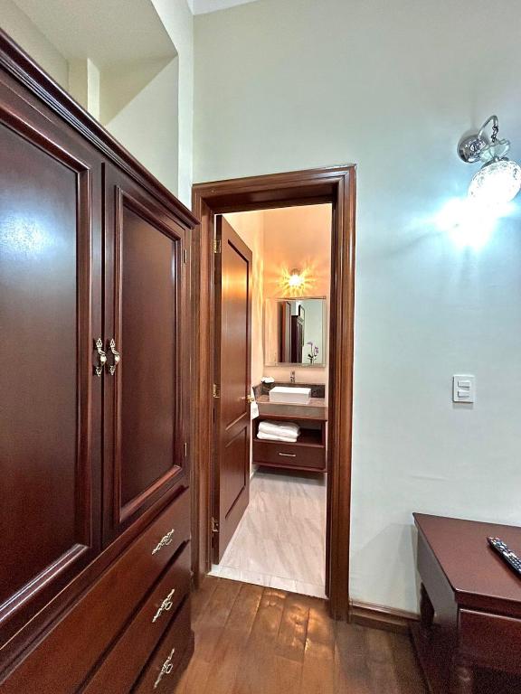 Postel nebo postele na pokoji v ubytování Hotel Cantera Real, Morelia
