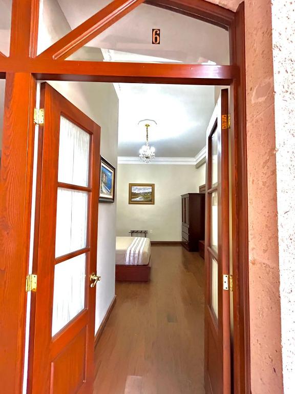 Postel nebo postele na pokoji v ubytování Hotel Cantera Real, Morelia